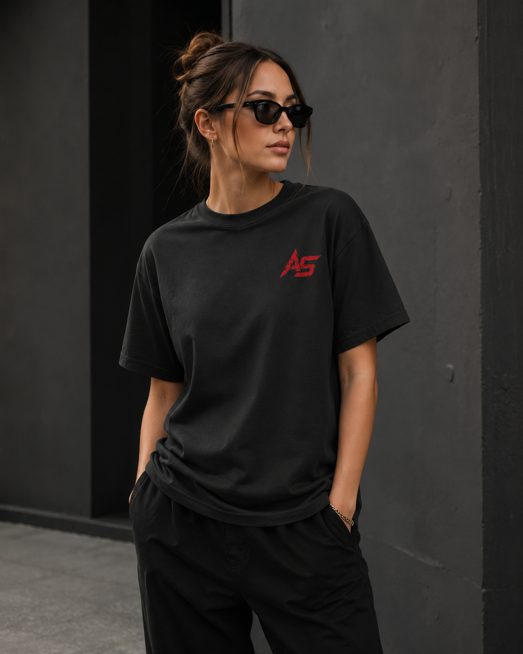 Female model wearing oversized black ApathySaves t-shirt with red AS chest logo