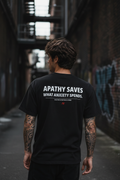 Apathy Saves What Anxiety Spends Tee – Male Lifestyle Back – Dark Urban Street – ApathySaves